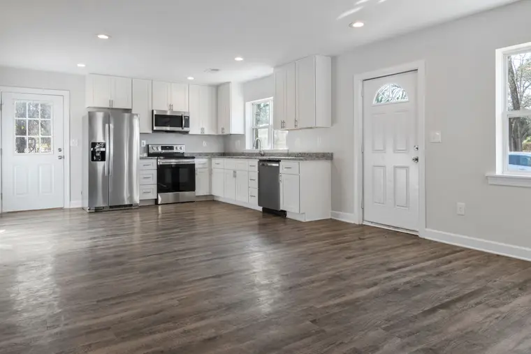 Spacious hardwood flooring in a kitchen